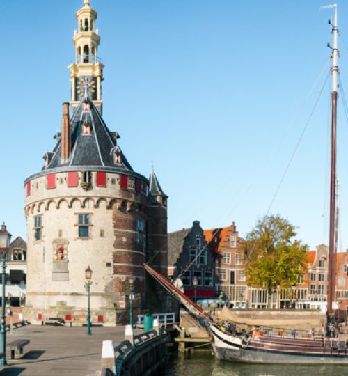 View to the small harbour in the city of Hoorn in the Netherlands. The tower is called the Hoofdtoren, dating from 1532. The houses date from the 16th and 17th century.
